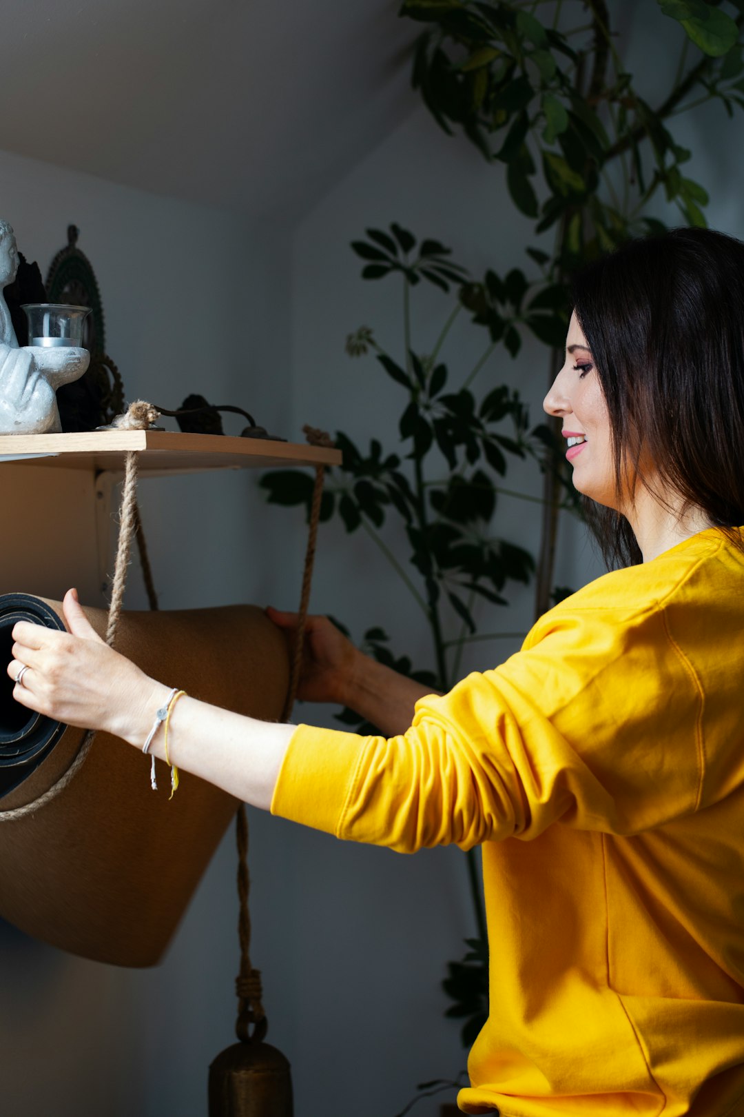 woman-in-yellow-shirt-arranging-plants-indoors-fu6b9mkmsmq